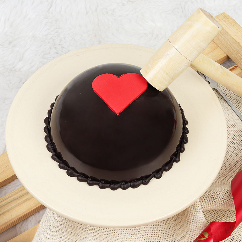 Black forest round shape hammer cake with a red heart on it